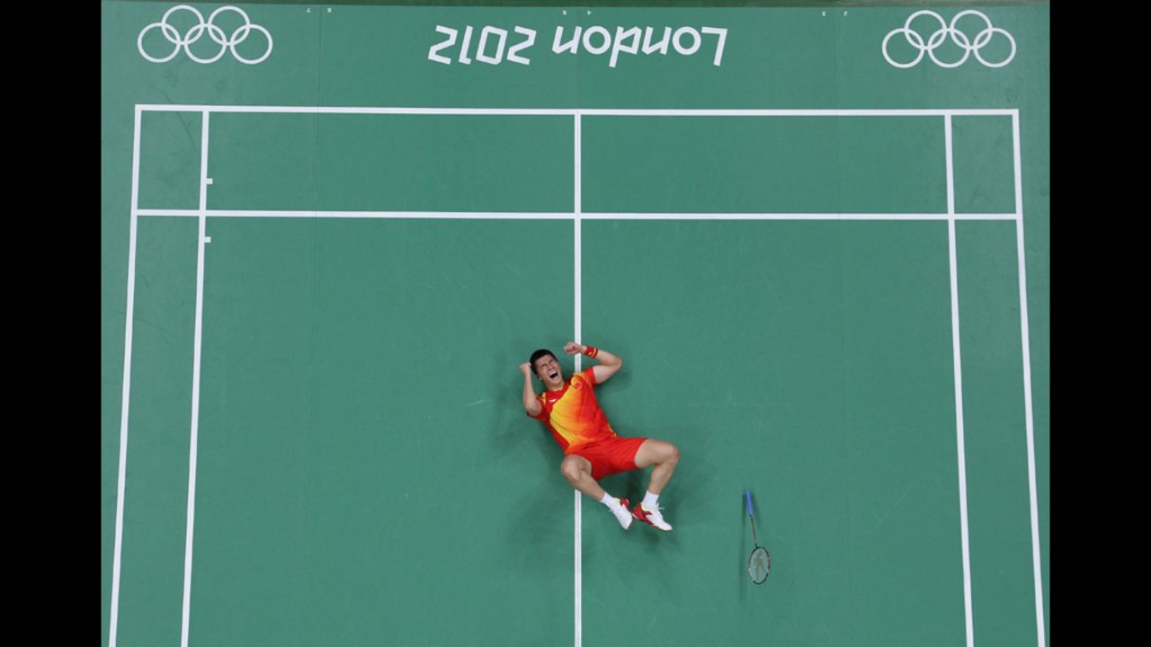Haifeng Fu of China celebrates a victory in the men's doubles badminton semifinal match Saturday against Boon Heong Tan and Kien Keat Koo of Malaysia.