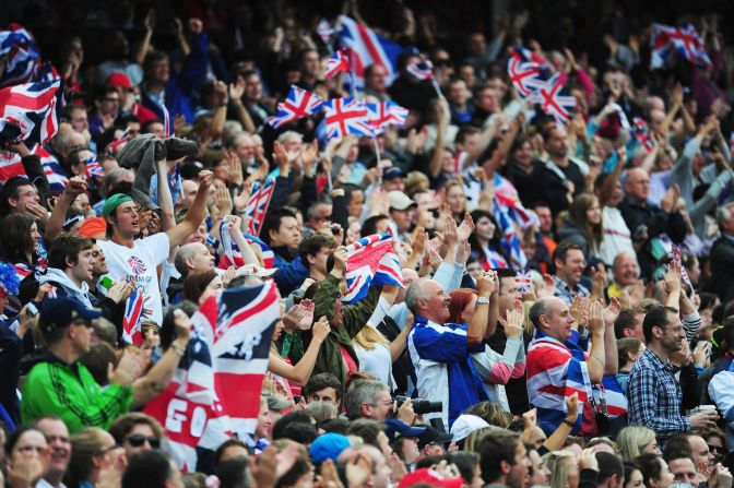 Spectators watch the track and field events at Olympic Stadium.