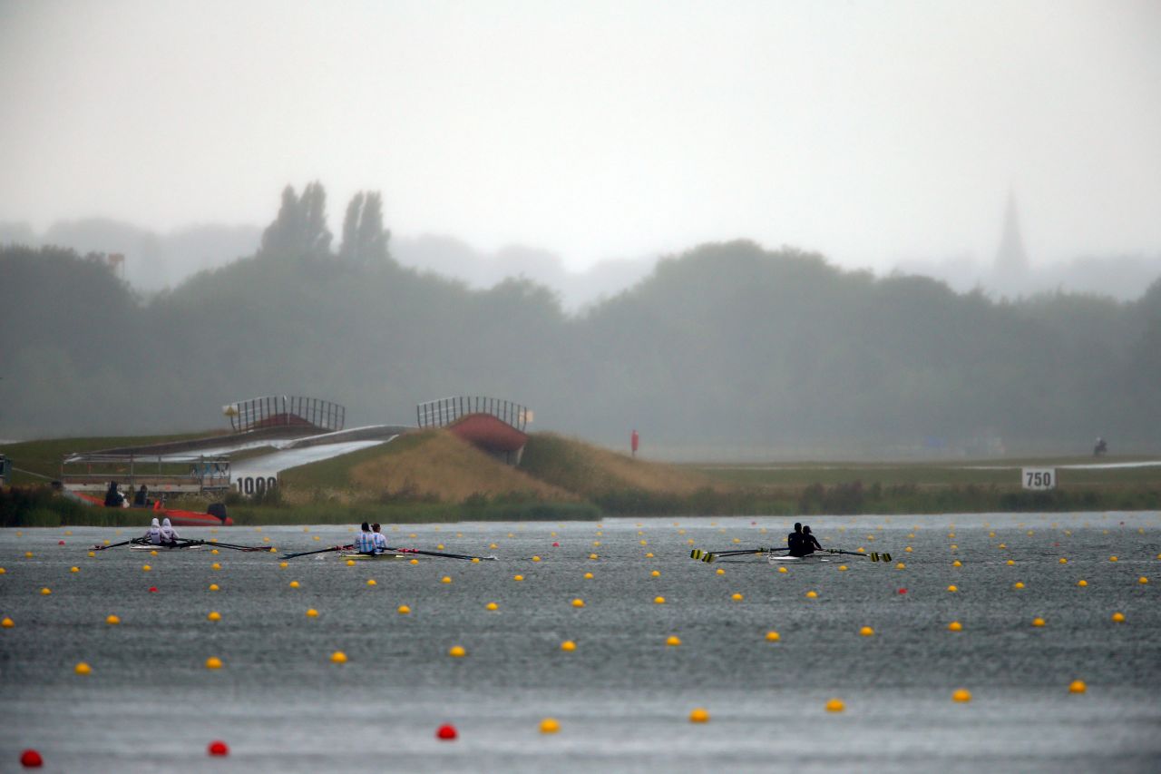 From left, Sara Mohamed Baraka and Fatma Rashed of Egypt, Maria Clara Rohner and Milka Kraljev of Argentina, and Luana De Assis and Fabiana Beltrame of Brazil compete in the lightweight women's double sculls finals at Eton Dorney in Windsor.