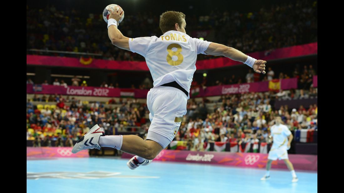 Spain's rightwing Victor Tomas Gonzalez jumps to shoot during the men's preliminary  handball match against Hungary.