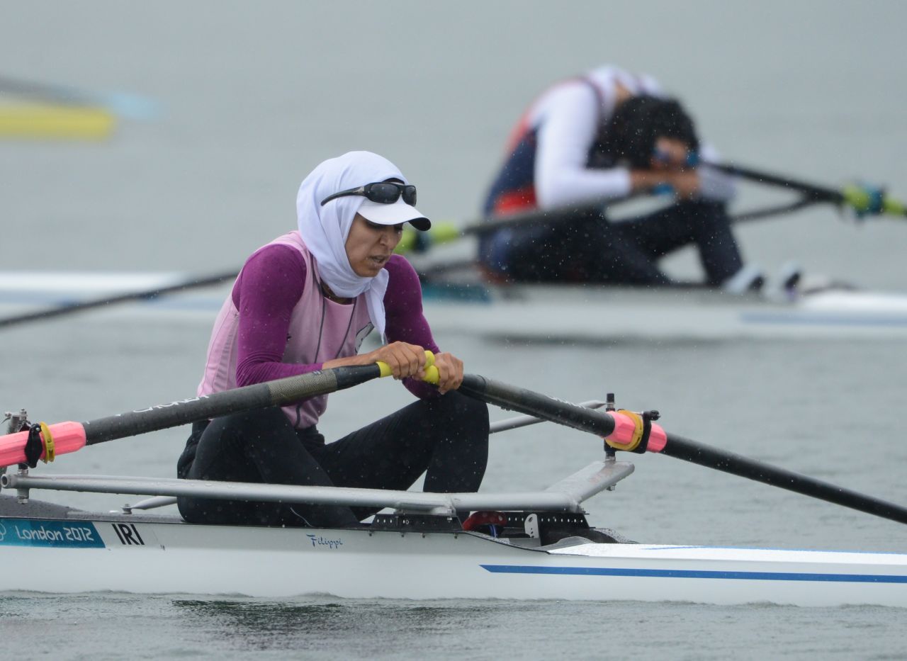 Iran's Soulmaz Abbasiazad rests after competing in the women's single sculls final of the rowing event Saturday.