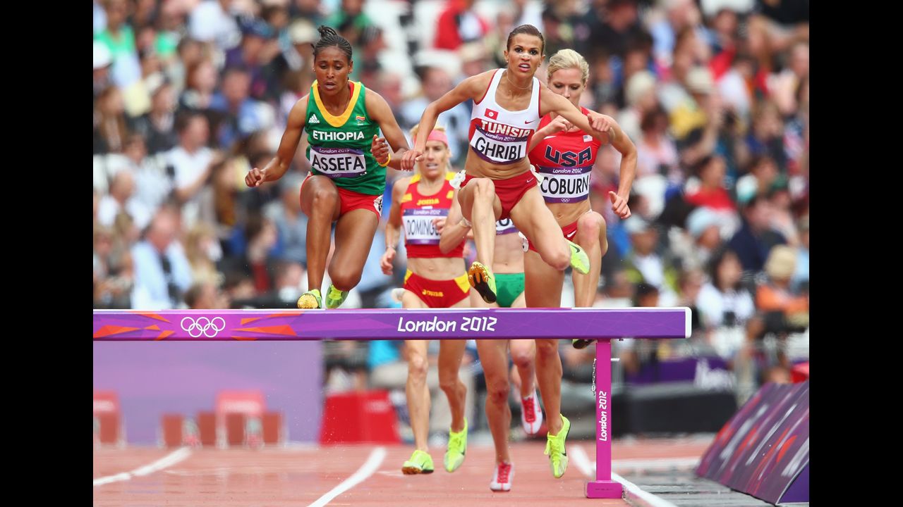 Sofia Assefa of Ethiopia, left, Habiba Ghribi of Tunisia and Emma Coburn of the United States compete in the women's 3,000-meter steeplechase.