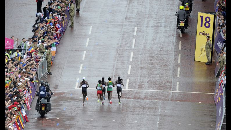 Left to right: Kenya's Priscah Jeptoo, Ethiopia's Mare Dibaba, Kenya's Mary Jepkosgei Keitany, Ethiopia's Tiki Gelana and Kenya's Edna Ngeringwony Kiplagat lead the pack in the women's marathon. Gelana would go on to win the gold medal.