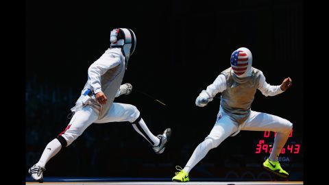 Erwan Le Pechoux of France faces off against Alexander Massialas of the United States during the men's foil team fencing quarterfinal.