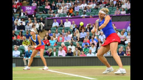 The Czech Republic's Andrea Hlavackova, left, and Lucie Hradecka, right, play against Venus and Serena Williams of the United States during the women's doubles gold medal match in Wimbledon.