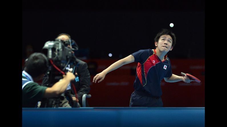 Japan's Koki Niwa serves to Hong Kong's Tang Peng during a men's team table tennis quarterfinal match.