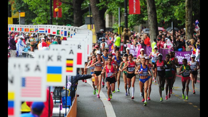 Runners make their way through London during the women's marathon.
