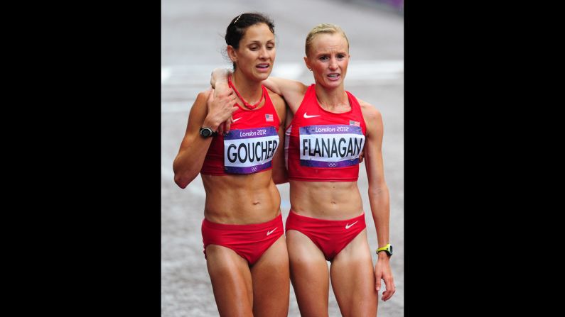 Kara Goucher, left, and Shalane Flanagan of the United States support each other after completing the women's marathon.