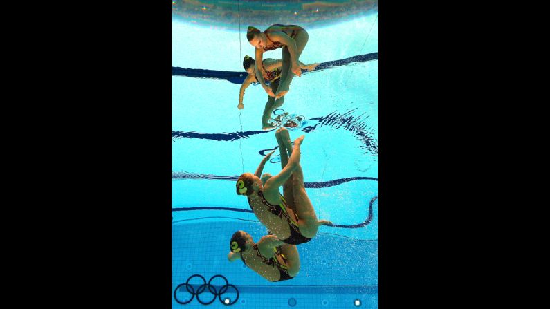 Mary Killman and Mariya Koroleva of the United States compete in the women's duets synchronized swimming technical routine.