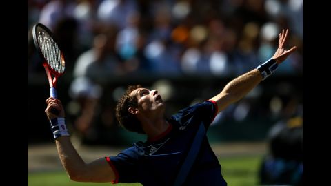 Andy Murray of Great Britain serves the ball to Roger Federer of Switzerland during the men's singles tennis gold medal match. Murrary went on to win the match.