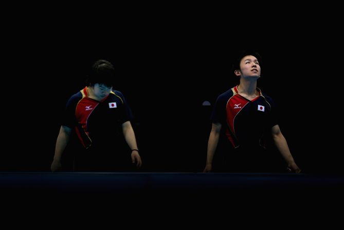 Seiya Kishikawa and Koki Niwa of Japan compose themselves during their men's team table tennis quarterfinal match against the team from Hong Kong.