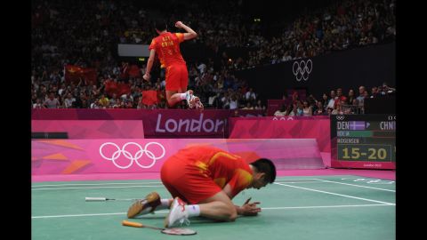 Yun Cai and Haifeng Fu of China revel in their victory against Mathias Boe and Carsten Mogensen of Denmark in the men's doubles badminton gold medal match.