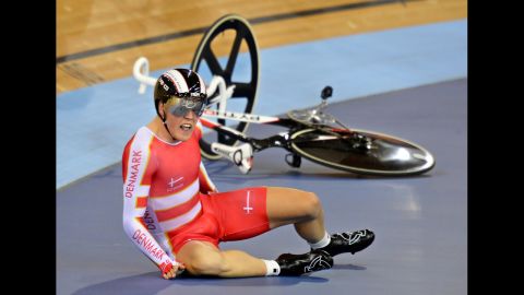 Denmark's Lasse Norman Hansen crashes during the men's 15-kilometer scratch race cycling event at the London Velodrome.