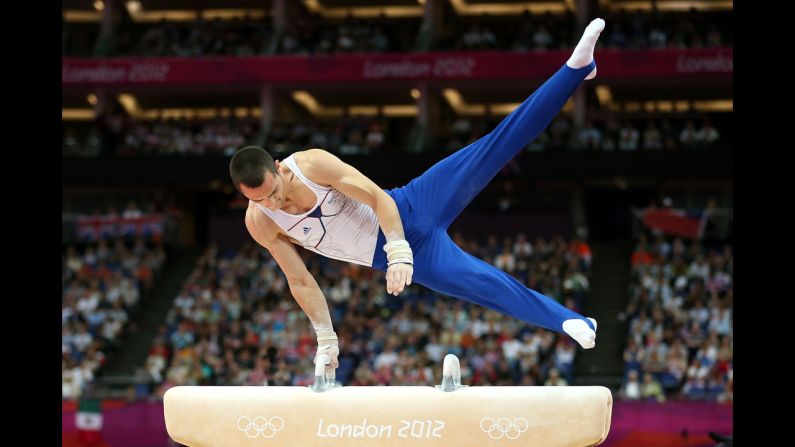 Cyril Tommasone of France performs his routine in the artistic gymnastics men's pommel horse final.