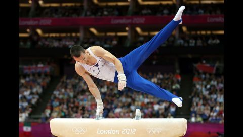 Cyril Tommasone of France performs his routine in the artistic gymnastics men's pommel horse final.
