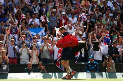 Andy Murray of Great Britain walks off the court after defeating Roger Federer of Switzerland and winning the gold medal in the men's singles tennis competition.