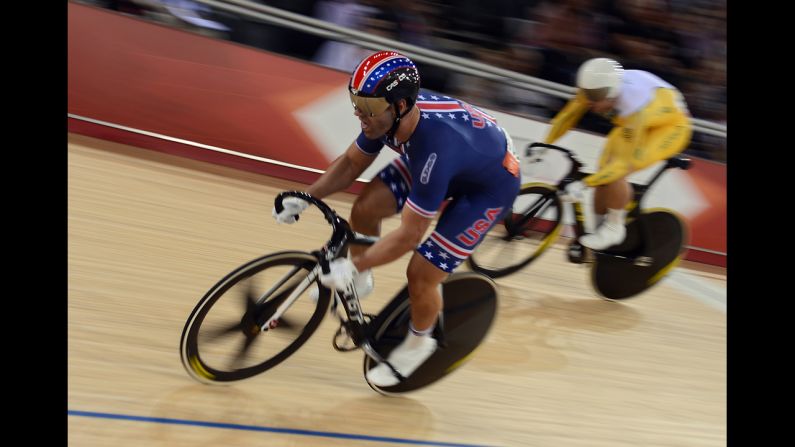 Jimmy Watkins, left, of the United States and Shane Perkins, right, of Australia fly around the track during the men's sprint quarterfinals cycling event.