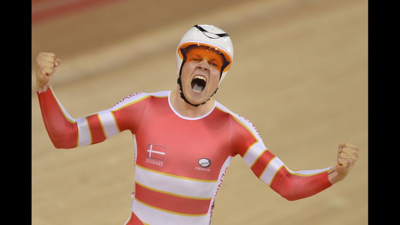 Denmark's Lasse Norman Hansen experiences the thrill of victory after winning the gold medal in the men's omnium 1 kilometer time trial cycling event.