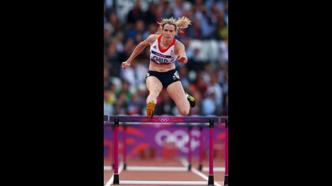 Eilidh Child of Great Britain clears a hurdle in the women's 400-meter hurdles round 1 heat.