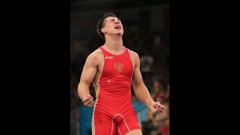 Roman Vlasov of Russia exults after he defeats Arsen Julfalakyan of Armenia in their men's Greco-Roman 74-kilogram wrestling gold medal bout.