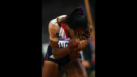 Yamile Aldama of Great Britain reacts after completing her jump in the women's triple jump final.