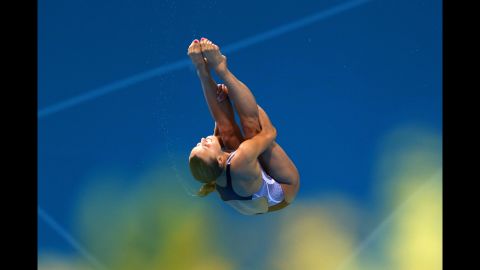  Tania Cagnotto of Italy performs an acrobatic dive in the women's 3-meter springboard diving final.