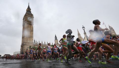 Competitors take part in the women's marathon event as rain falls on Day 9 of the London 2012 Olympics.