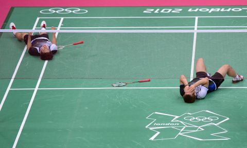South Korea's Lee Yong Dae, left, and Chung Jae Sung celebrate their victory over the Malaysian team during the bronze medal men's doubles badminton match.