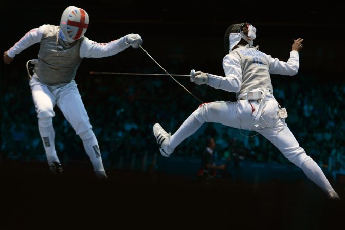 Britain's James Davis, left, fences against Italy's Andrea Baldini during the men's foil team quarterfinals.