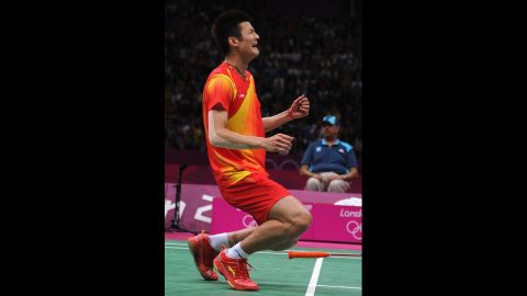Long Chen of China celebrates winning the bronze medal in the men's singles badminton event, beating Hyun Il Lee of South Korea.