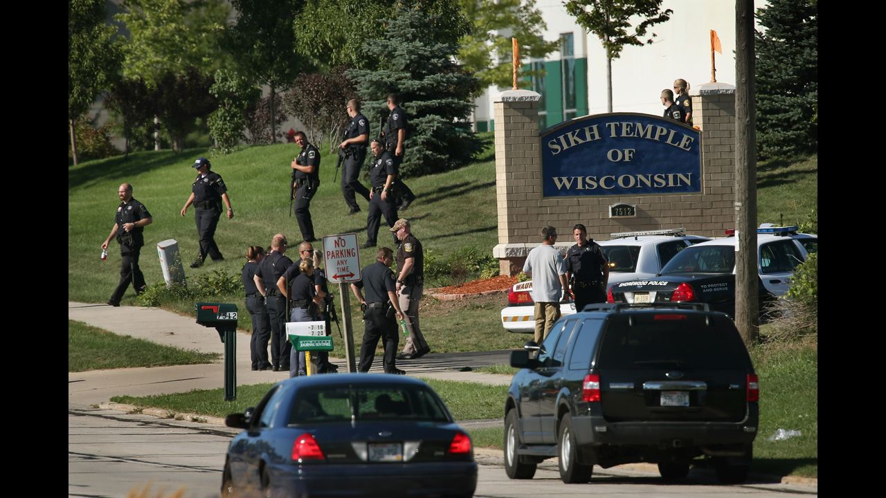 Police work outside the entrance to the temple, near Milwaukee.