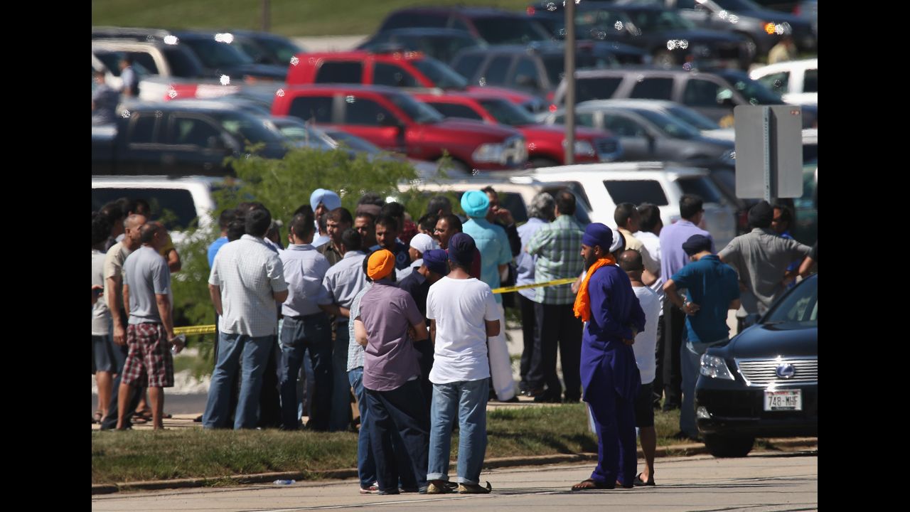 People wait for word on family and friends in front of the Sikh temple. The Oak Creek temple, or gurdwara, opened in 2007. 