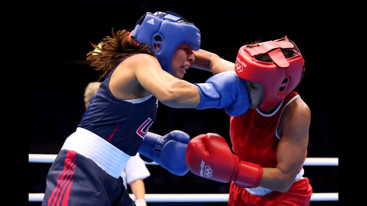 Marlen Esparza, left, of the United States connects with Karlha Magliocco of Venezuela during the women's fly (51-kilogram) boxing quarterfinals.