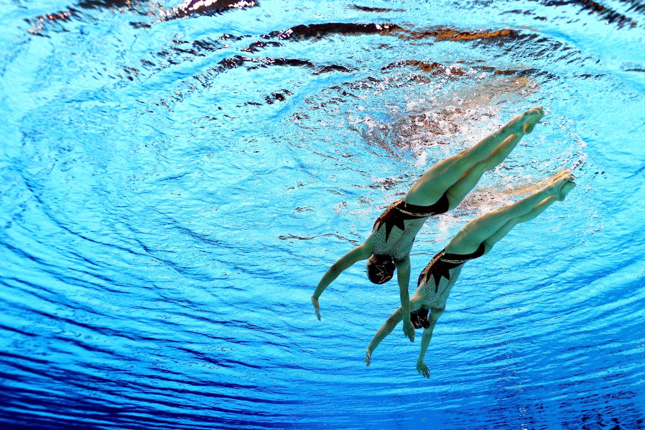 Mi Hyang and Yon Hui Jong of North Korea take part in the women's duets synchronized swimming free routine preliminary.