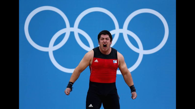 Jorge Eduardo Garcia Bustos of Chile shows his enthusiasm in the men's 105-kilogram weightlifting event.