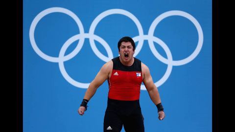Jorge Eduardo Garcia Bustos of Chile shows his enthusiasm in the men's 105-kilogram weightlifting event.
