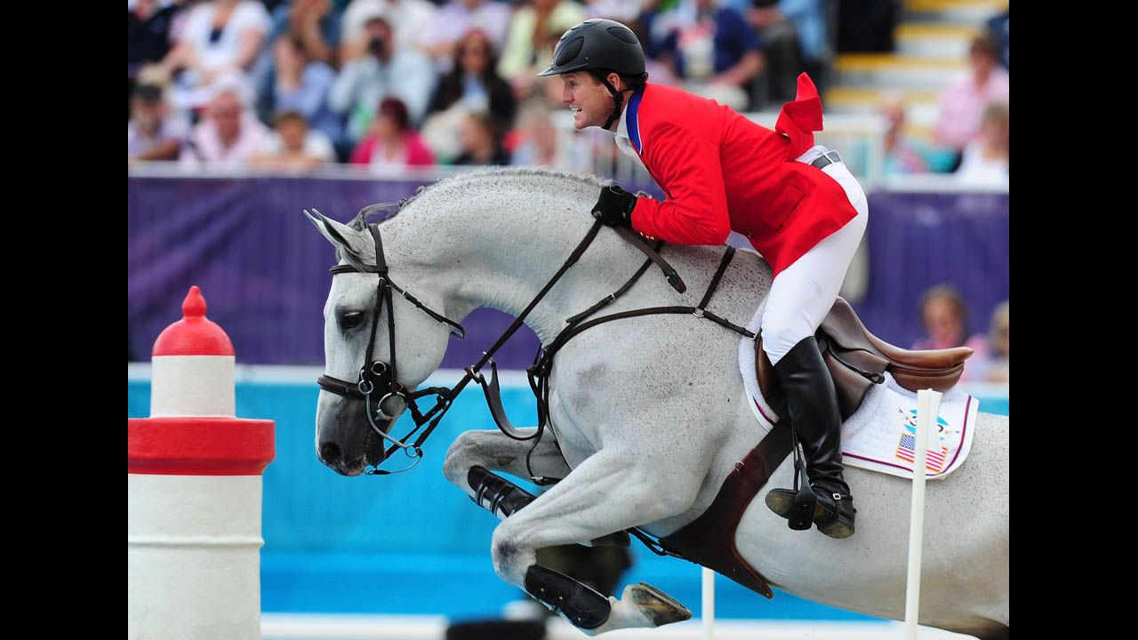 McLain Ward of the United States, riding Antares, competes in the third qualifier of individual jumping.