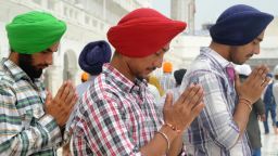 Indian Sikh devotees pay their respects at the Golden Temple in Amritsar on August 6, 2012.