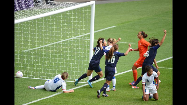 Japan's soccer team celebrates after scoring during the semifinal against France.