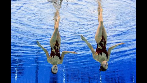North Korea's Jang Hyang Mi and Jong Yon Hui compete in the duets free routine preliminary round of the synchronized swimming competition.
