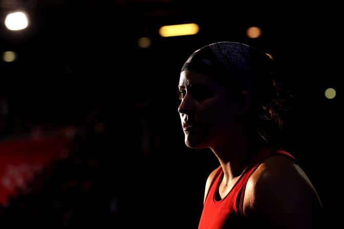 Mary Spencer of Canada watches Jinzi Li of China during the women's middle 75-kilogram boxing quarterfinals.