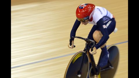 Britain's Laura Trott competes during the women's omnium flying lap 250-meter time trial cycling event at the Velodrome in London.
