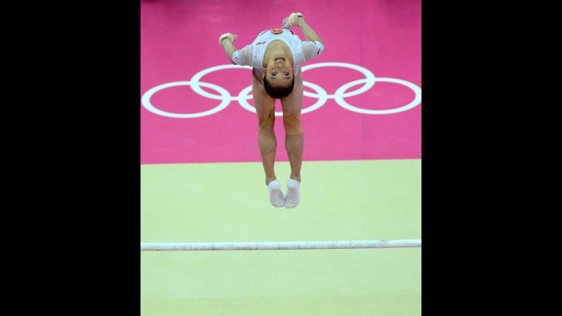 Yao Jinnan of China performs on the uneven bars.
