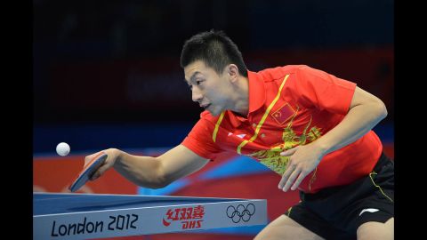 China's Ma Long returns the ball during his men's team table tennis semifinal match against Germany.