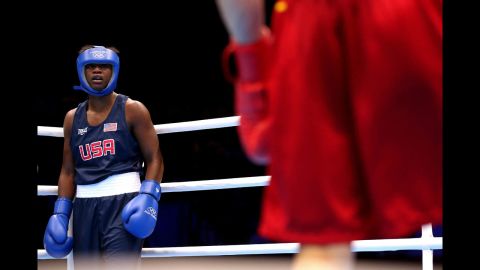 Claressa Shields, left, of the United States takes on Anna Laurell of Sweden during the women's middle 75-kilogram boxing quarterfinals.