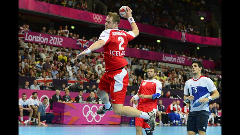 Iceland pivot Vignir Svavarsson jumps to shoot during the men's preliminary Group A handball match against Great Britain. Iceland won 42-24.