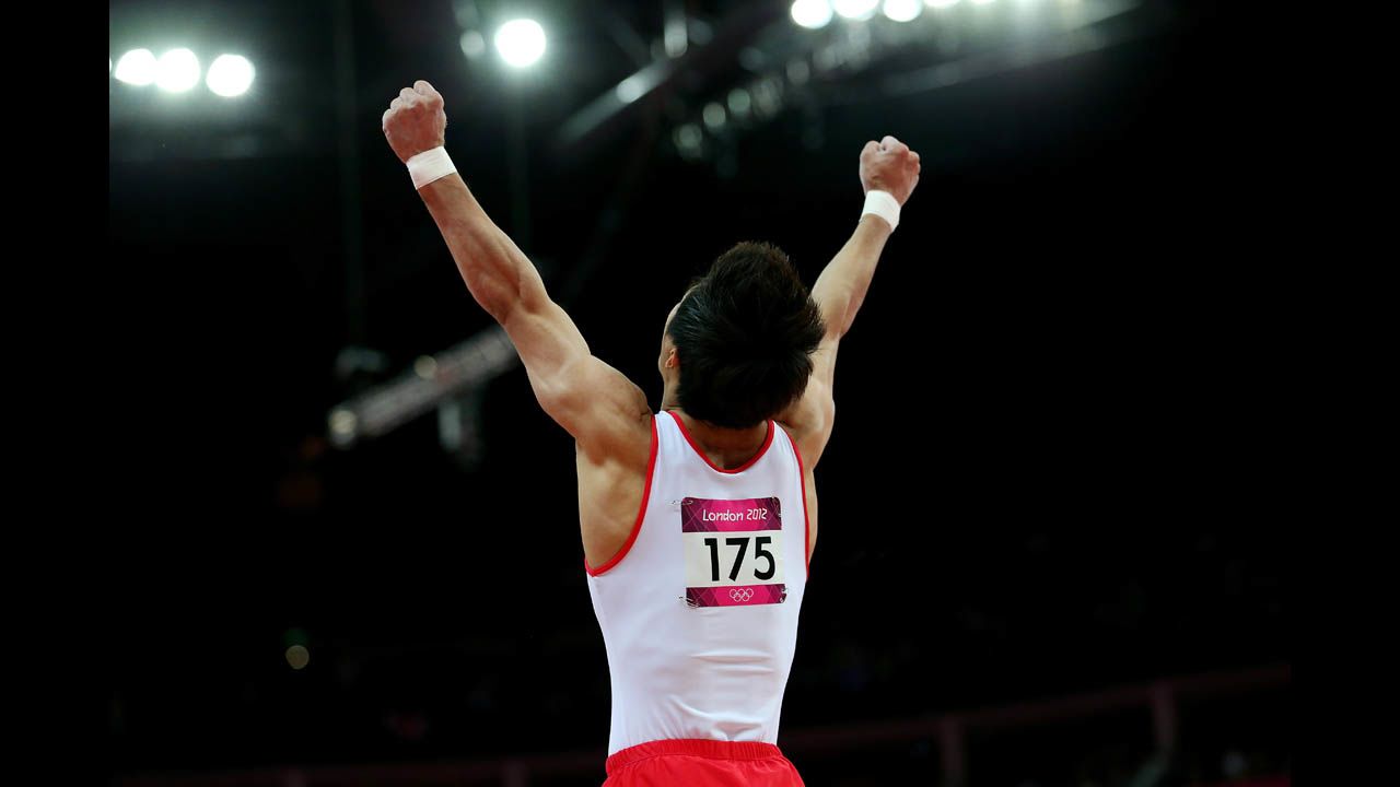 Gymnast Hak Seon Yang of South Korea celebrates his vault.