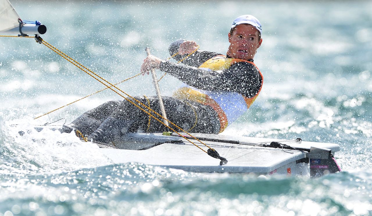 Australia's Tom Slingsby looks back at his rivals as he takes gold in the laser sailing class competition.