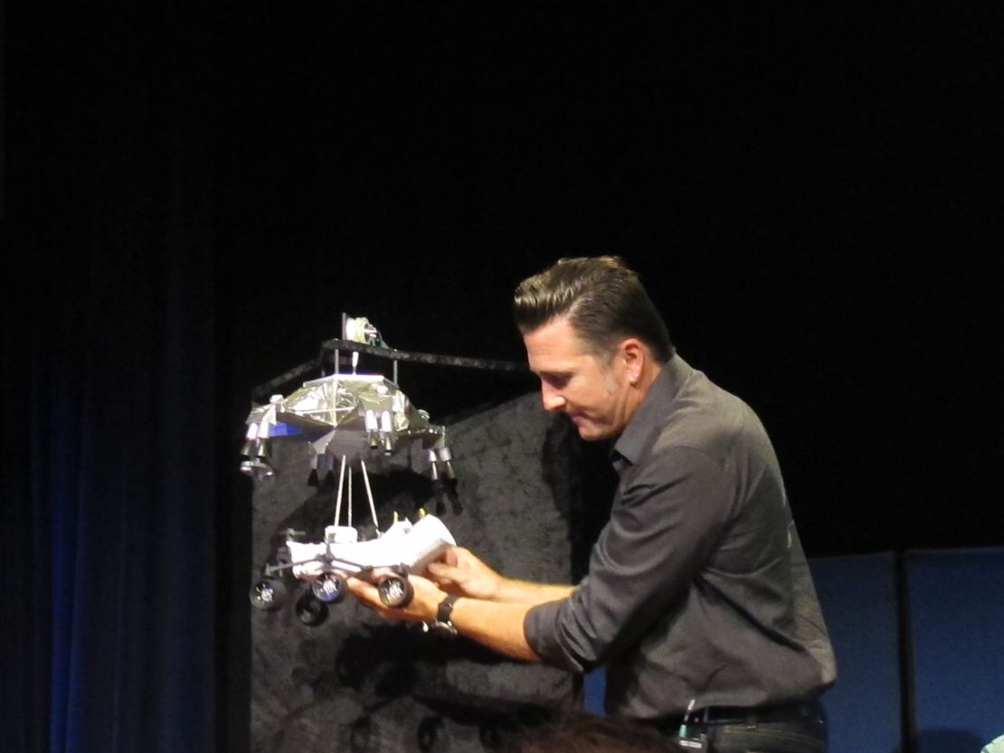 NASA engineer Adam Steltzner demonstrates the rover landing process at the Jet Propulsion Laboratory.