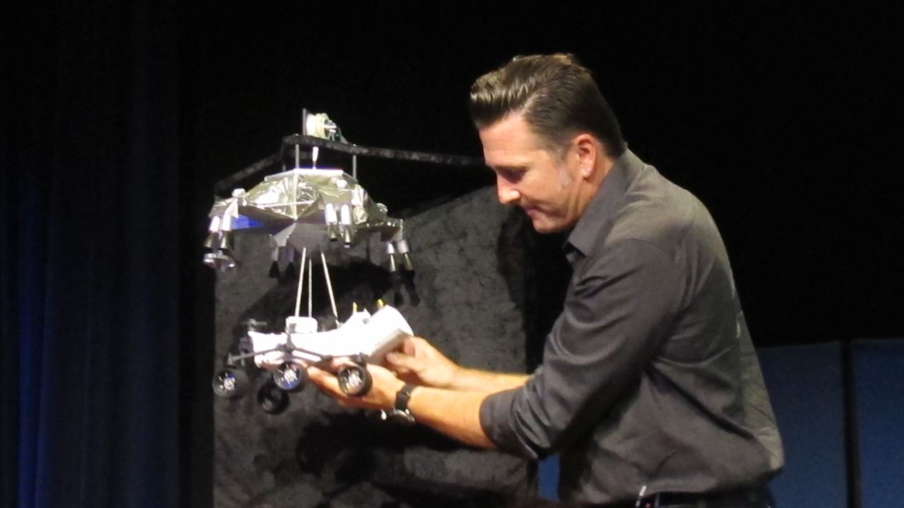 NASA engineer Adam Steltzner demonstrates the rover landing process at the Jet Propulsion Laboratory.